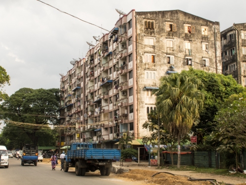 A building in Yangon. A right mix of mould, wiring, satellite dishes and drops of colour